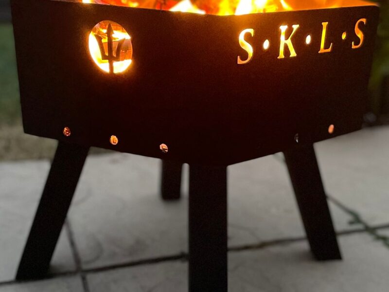 Bespoke industrial steel fire pit by Fuscina in outdoor use