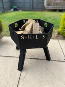 industrial fire pit with logs inside