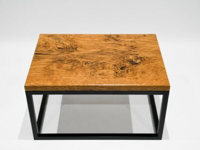 Side view brown oak and steel coffee table