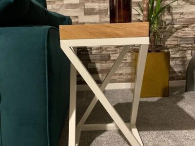 white and oak industrial style end table next to sofa