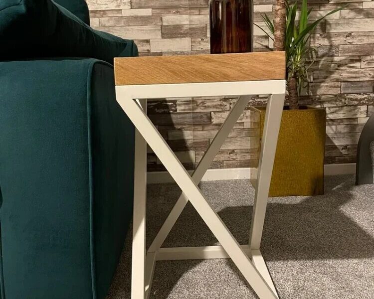 white and oak industrial style end table next to sofa