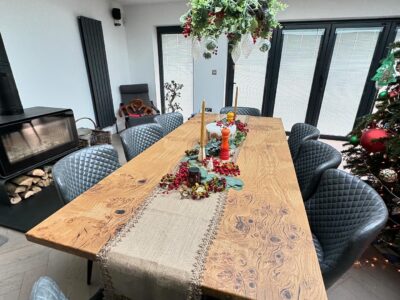 Bespoke Fuscina dining table decorated with Christmas styling in a customer home