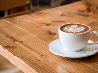 Coffee shop with wooden tables and steel-framed chairs