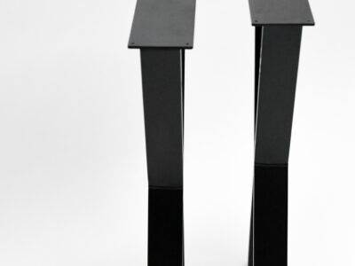 Tall bespoke black steel X-shaped table legs from the side by Fuscina