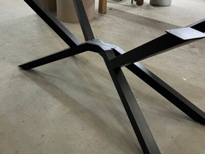 Bespoke steel spider table frame by Fuscina, side view