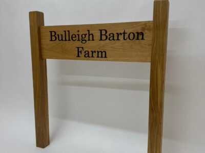 Custom wooden sign post with engraved lettering by Fuscina