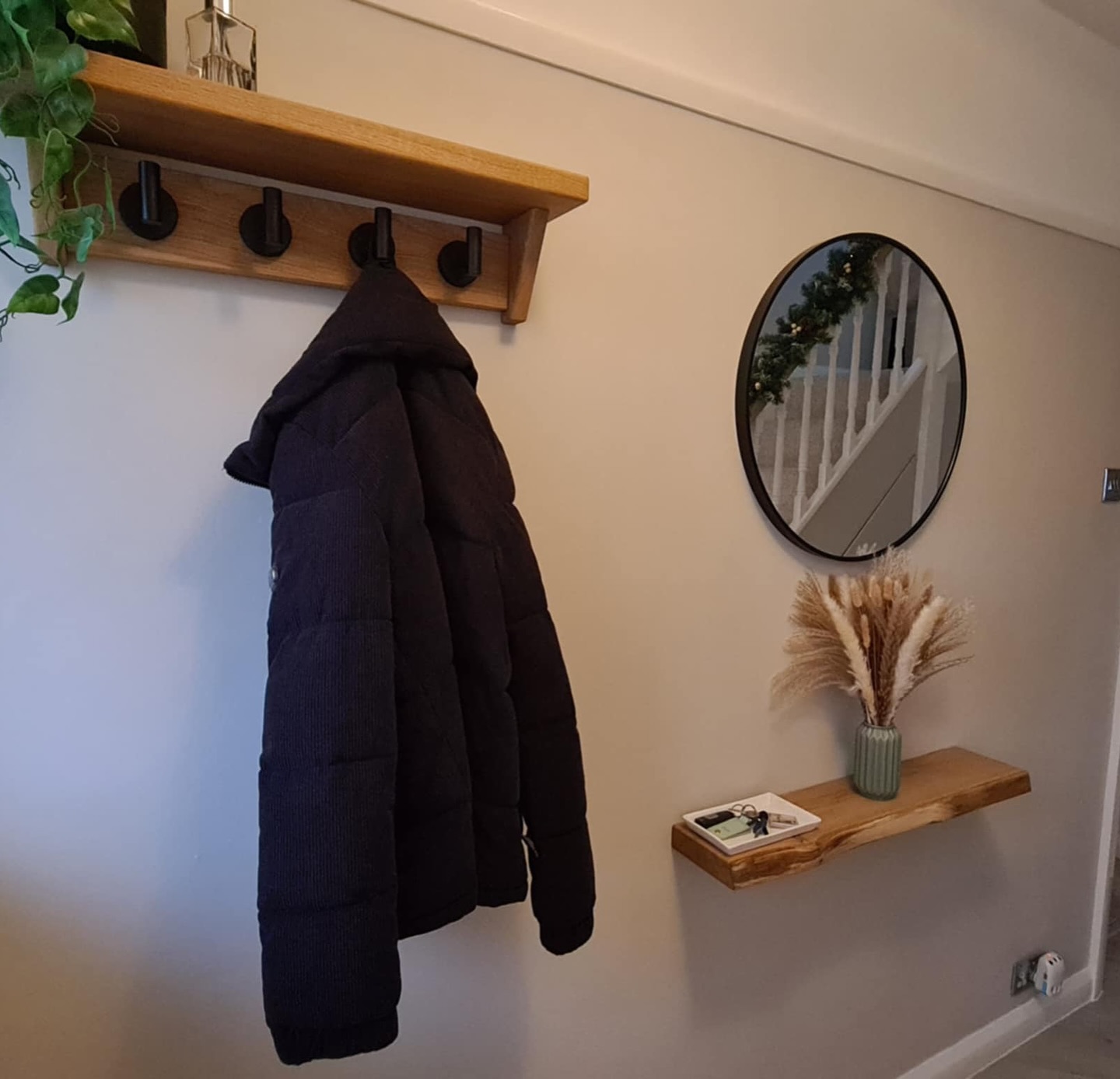Bespoke Fuscina oak coat rack with steel hooks mounted on a wall
