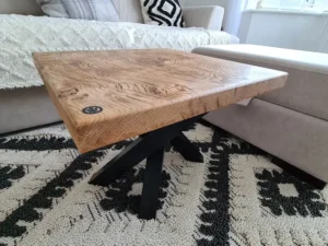 Oak coffee table and steel legs on rug