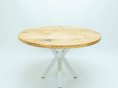 Rectangular oak coffee table with white steel legs at a full-length angle