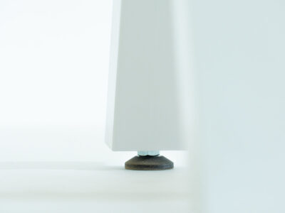 Close up of wooden table leg and foot